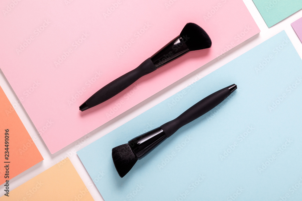 makeup brushes on pastel paper pink background makeup brushes on pastel paper pink background