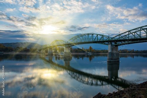 Amazing view of Maria Valeria bridge with reflection in Danube river, Esztergom, Hungary at sunrise