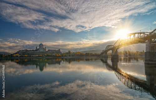 Scenic view of Esztergom Basilica and Maria Valeria bridge with reflection in Danube river, Hungary at sunrise photo