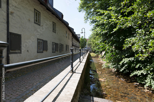 River Abzucht flowing through the center of Goslar, Germany photo