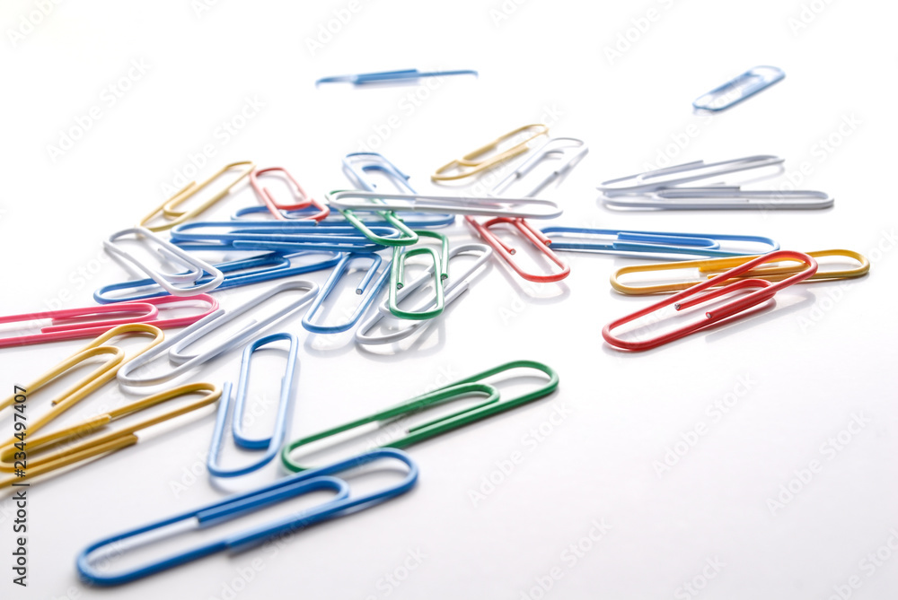 Colorful pishpins on white. Office supplies on white. Colorful pishpins on white. Office supplies on white.