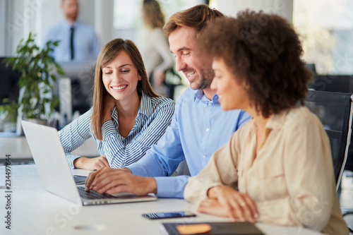 Startup concept -  creative team talking in office