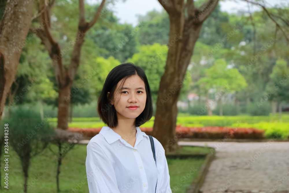 portrait of young woman at a park in Vietnam portrait of young woman at a park in Vietnam