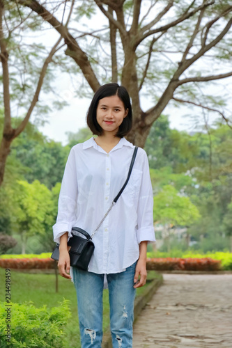 portrait of young woman at a park in Vietnam