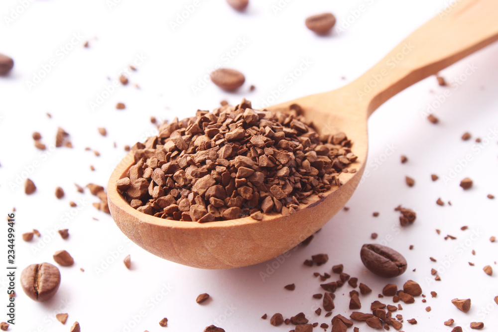 instant coffee in a spoon and coffee beans isolated on white. Aromatic coffee, coffee drinks instant coffee in a spoon and coffee beans isolated on white. Aromatic coffee, coffee drinks