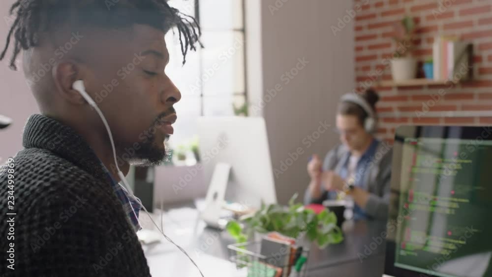portrait african american man programmer coding network security software for startup company professional web developer smiling enjoying typing code on computer screen in successful office