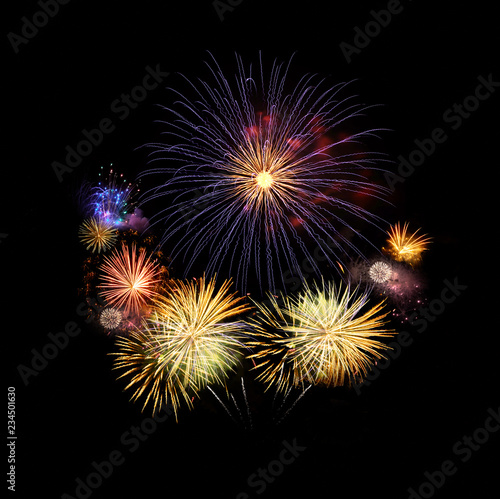 Fireworks abstract colorful explosions isolated on black, festival and celebration concept