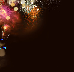 Fireworks explosions border on black, celebrating New Year festive