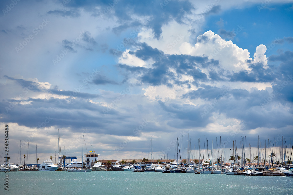 Stormy clouds over marina in Port de Alcudia, Mallorca.