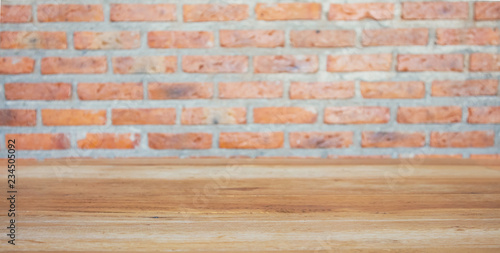wood table with brick wall background