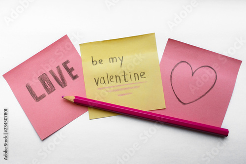 valentine’s day theme stickers on a white background. Love, be my Valentine handwritten inscriptions, heart and pink pencil on the white surface