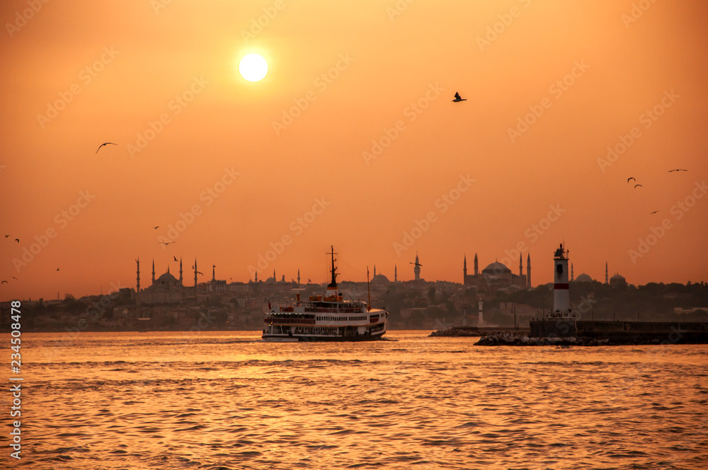 Istanbul silhouette and  old passenger ship in sunset