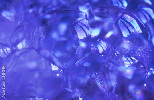 Transparent soap bubbles of a blue shade