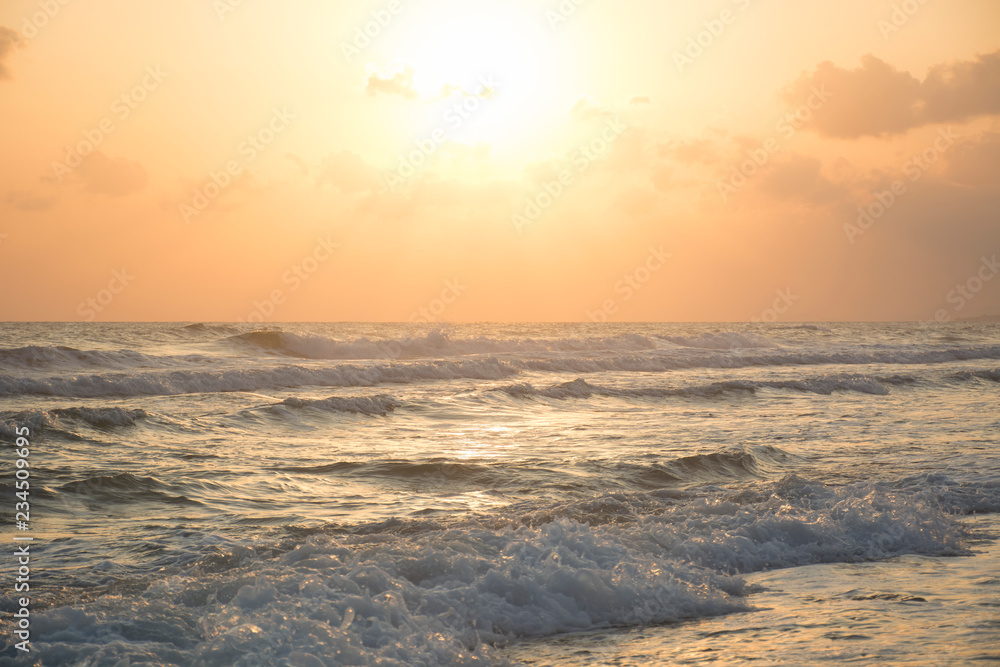 Sunrise at sea. Sunny path and waves. Georgioupolis beach, Crete Greece Sunrise at sea. Sunny path and waves. Georgioupolis beach, Crete Greece
