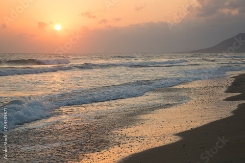 Sunrise at sea. Sunny path and waves. Georgioupolis beach  Crete Greece