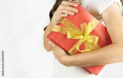 Young beautiful girl holds a gift in his hands close-up ©  Даниил Дудник