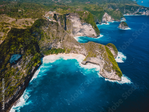 Kelingking beach and blue ocean in Nusa Penida. Aerial drone view of tropical island
