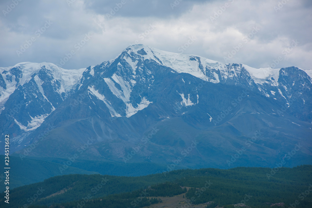 North-Chui ridge in Summer in Kurai steppe of Altai mountains, Russia. Cloud day.