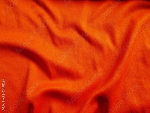 orange sportswear cloth texture,silk fabric background,orange satin clothing,orange background