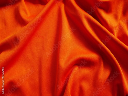 orange sportswear cloth texture,silk fabric background,orange satin clothing,orange background