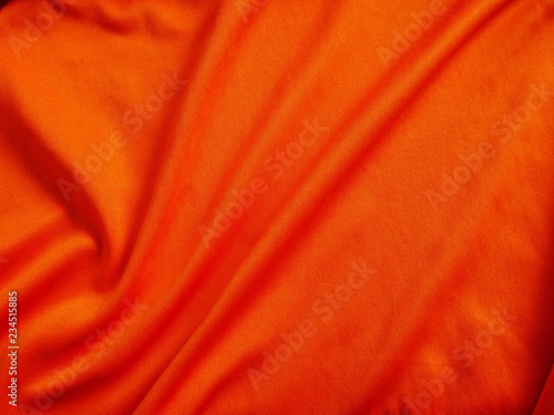 silk fabric background,texture of fabric cloth,orange sportswear clothing