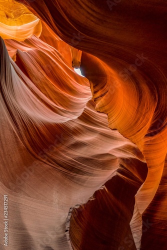 A spiral of rock wall stretches skyward in lower Antelope Canyon, Page, Arizona