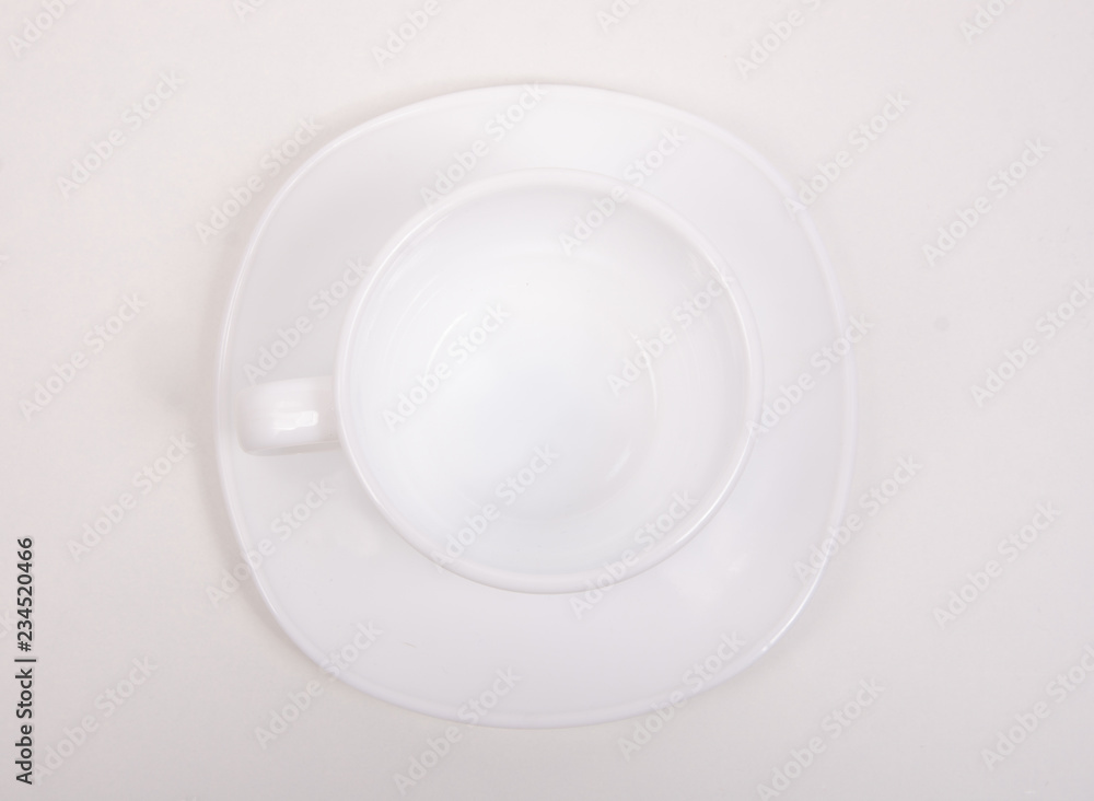 White saucer cup on white background isolation, top view White saucer cup on white background isolation, top view