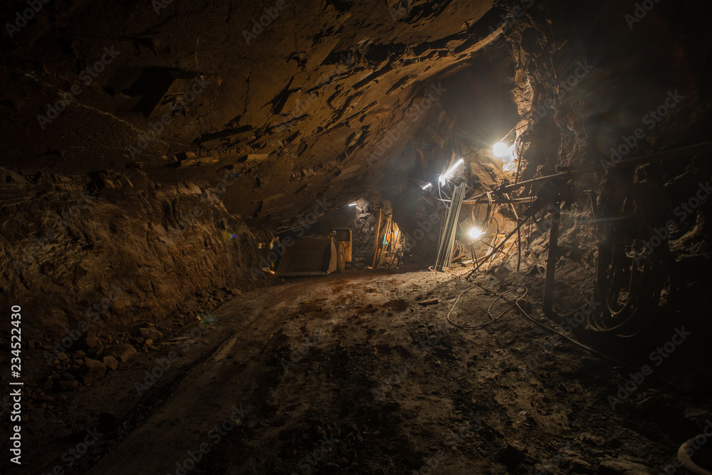Underground gold iron ore mine shaft tunnel gallery passage incline with light