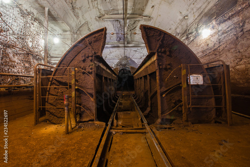 Underground gold iron ore mine shaft tunnel gallery passage with wagon rotating machine