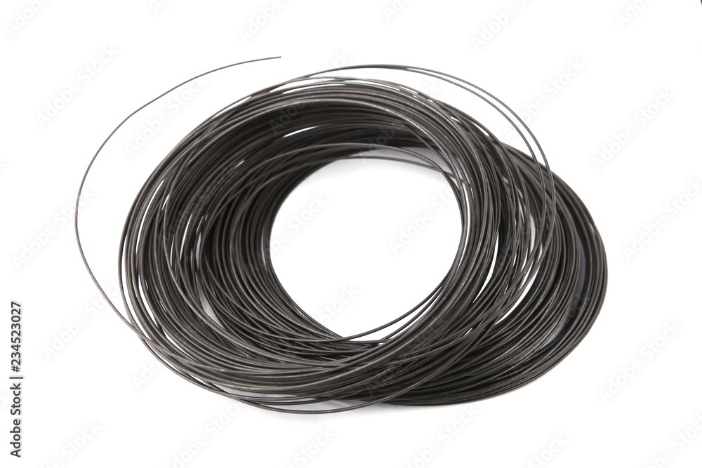Coil of galvanized wire isolated on white background. Stack of black galvanized metal wire. Coil of galvanized wire isolated on white background. Stack of black galvanized metal wire.