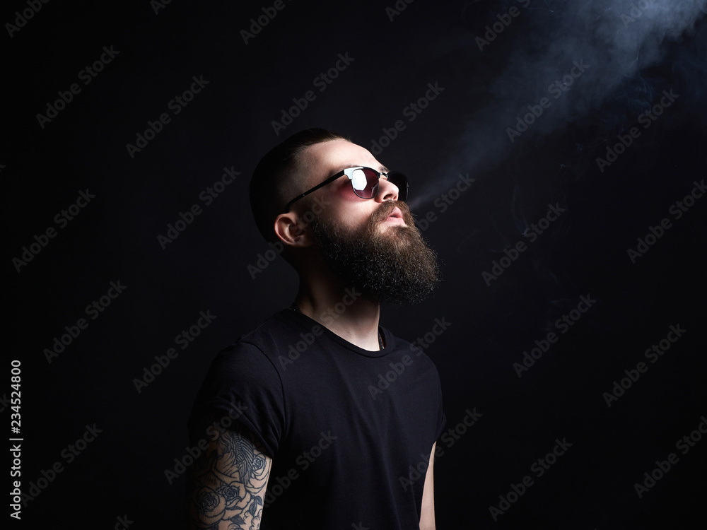 Brutal bearded man in sunglasses Brutal bearded man in sunglasses