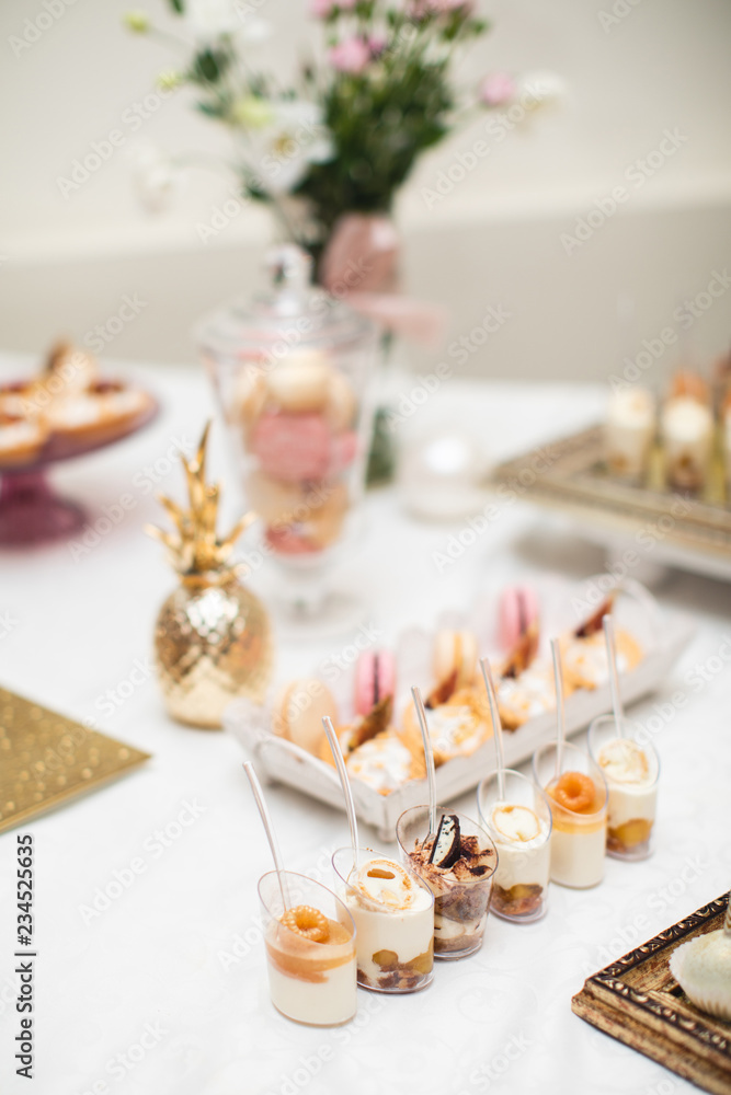 beautifully decorated table with sweet candy bar