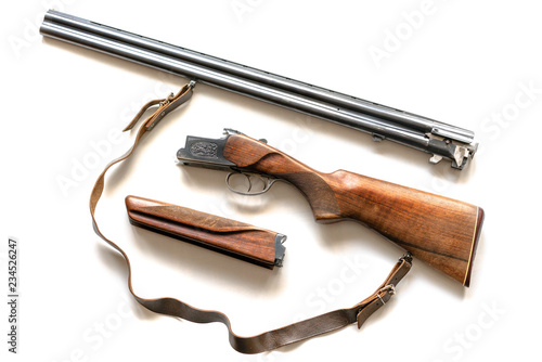 Weapons in a disassembled state. 12 gauge over under shotgun isolated on white background