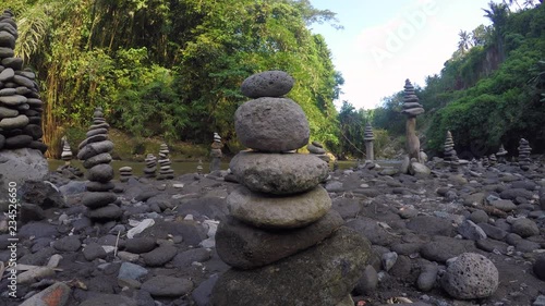 cairn at a waterfall in Indonesia