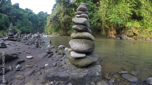 cairn at a waterfall in Indonesia
