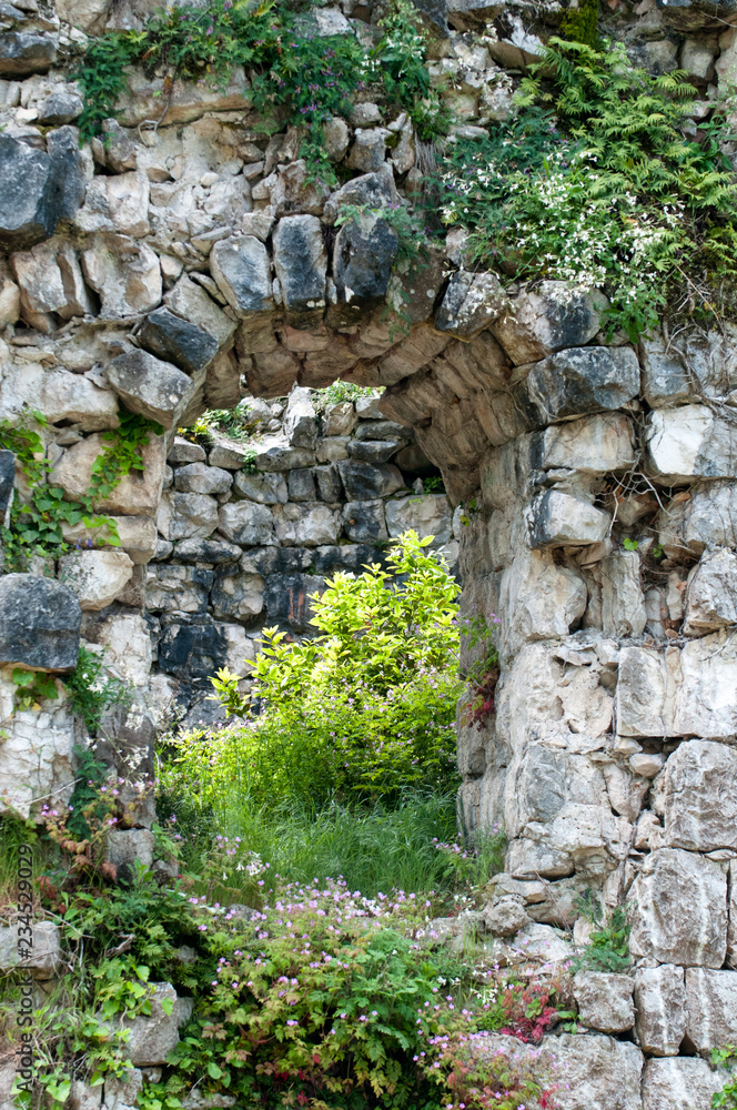 A small window in the ancient stone wall of the former fortress