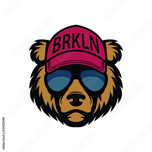 Cool bear in sunglasses. Grizzly in cap