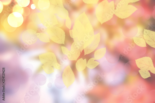 Abstract autumn gradient yellow pink bright background texture with leaves and bokeh circles. Indian summer. Card design.