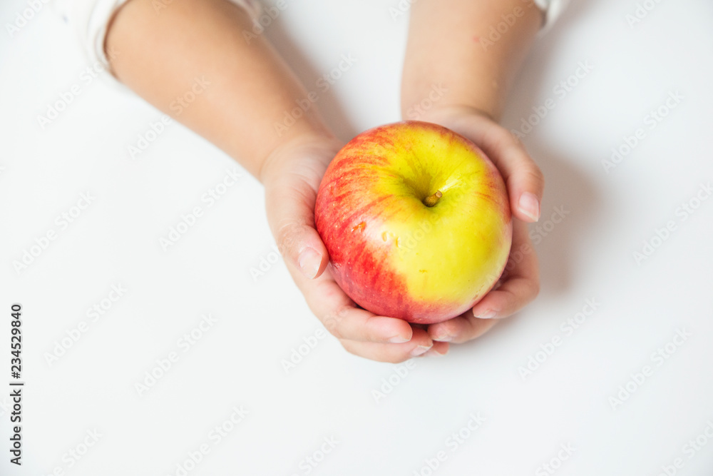 Hand holding Red apple on white background Hand holding Red apple on white background