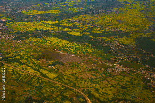 Beautiful valley of Kashmir, India. Stunning view of mustard field on the ground ,tourist and travel concept.(view from aircraft)