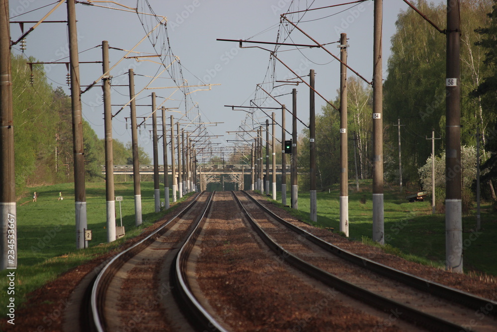 Railway station with rails and electric lines for electric train Railway station with rails and electric lines for electric train