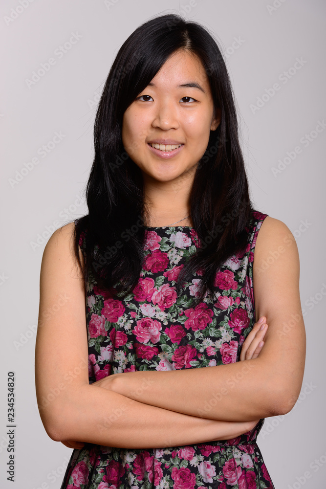 Studio portrait of young happy Asian woman Studio portrait of young happy Asian woman