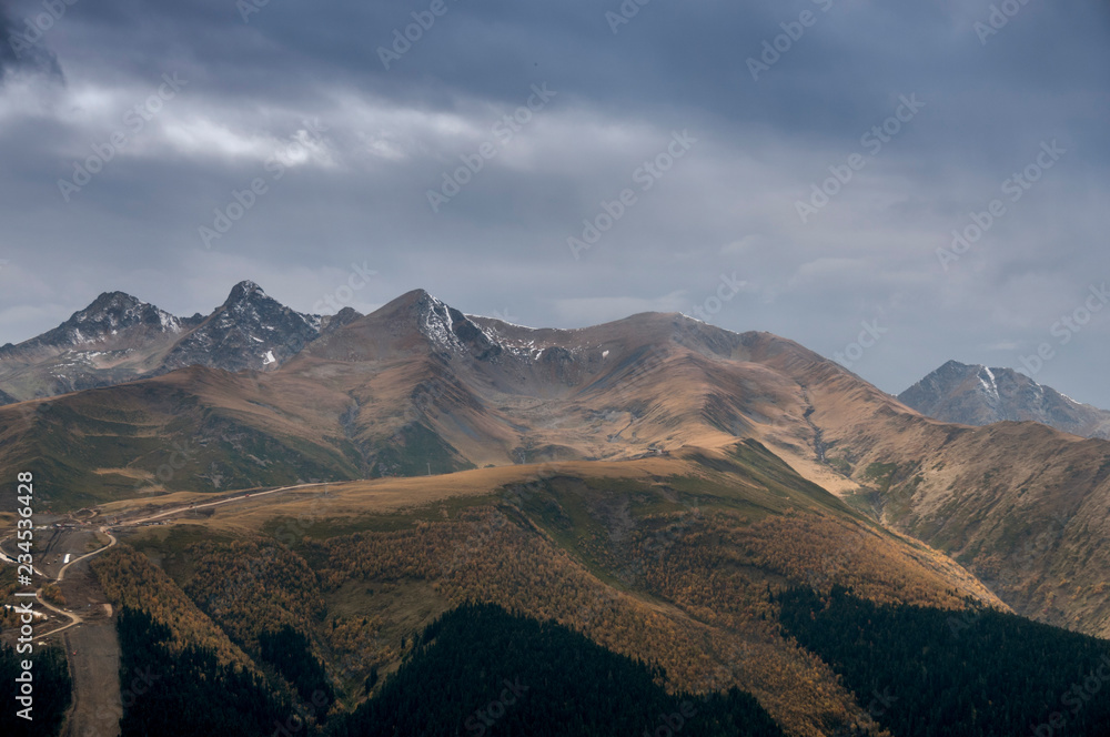 Dark mountain landscape. Caucasian mountains in cloudy weather.