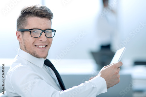 Attractive businessman working with tablet and touching digital 