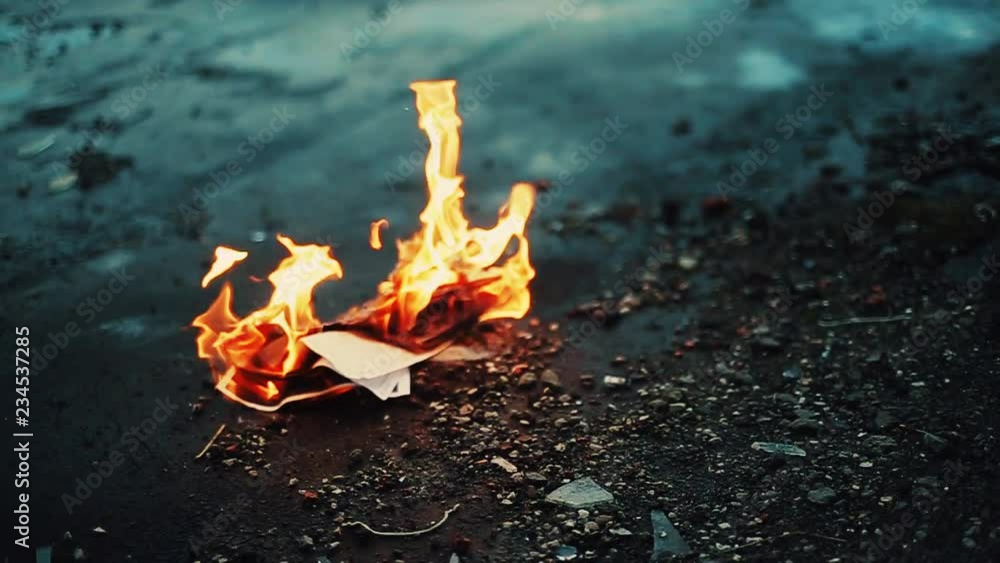 Person burning love letters. Depression. Freedom of past. Fire, paper