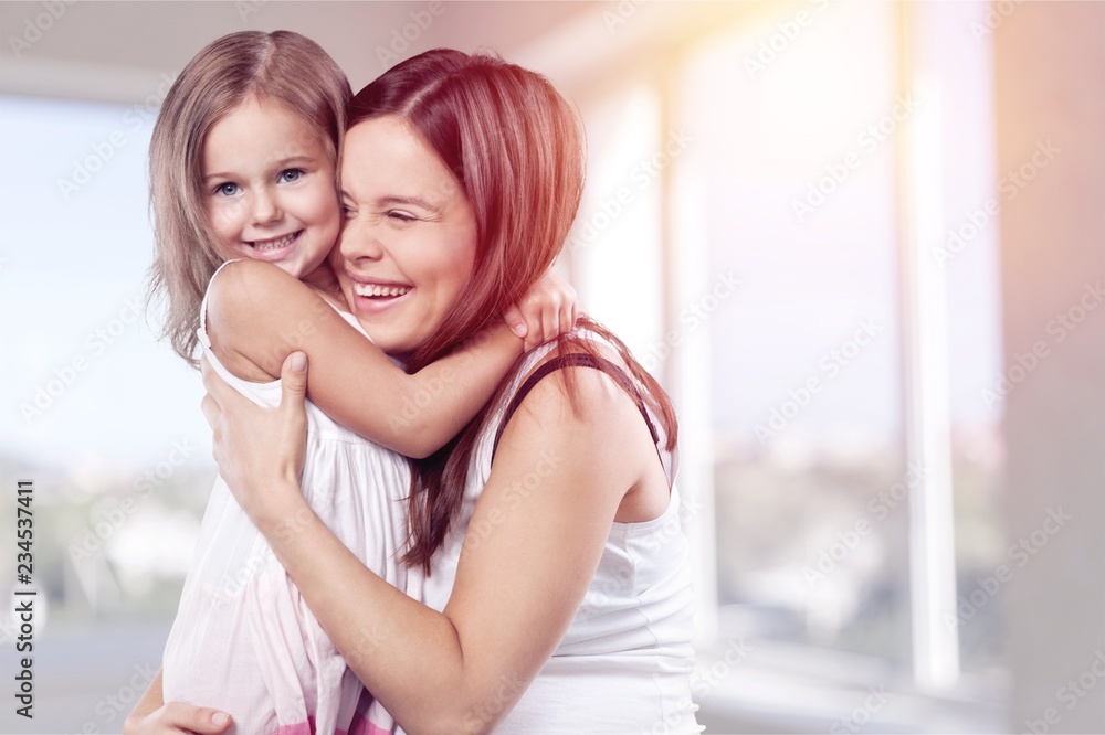 Happy Mother and daughter hugging Happy Mother and daughter hugging