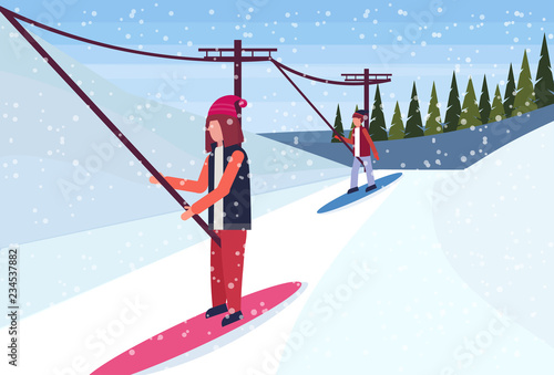 woman snowboarder using ski lift cable way winter snowy mountain fir tree forest landscape horizontal flat