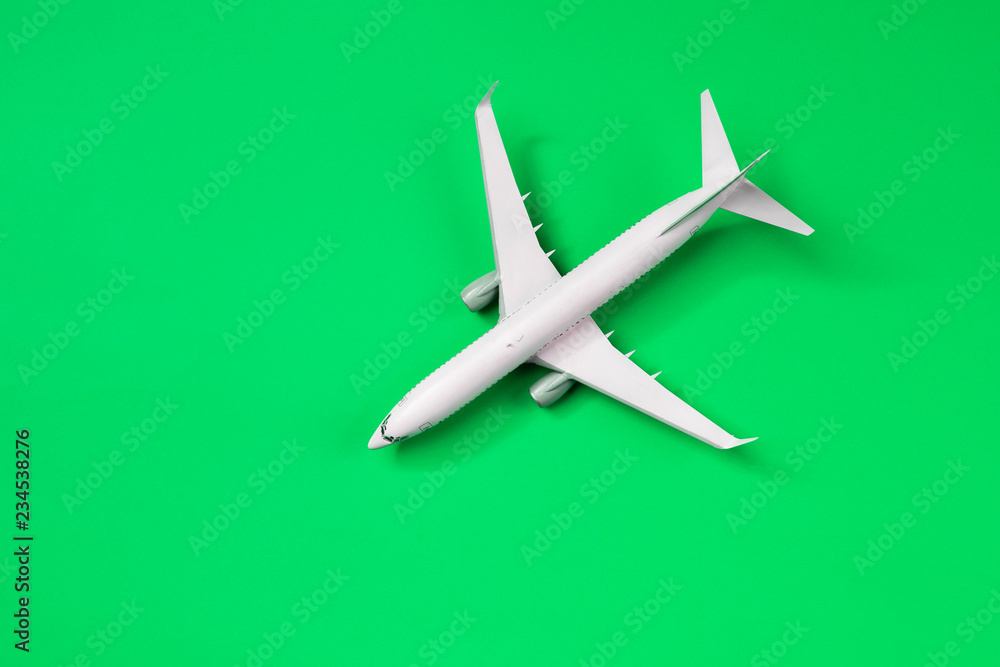 Image of airplane isolated on empty green background Image of airplane isolated on empty green background