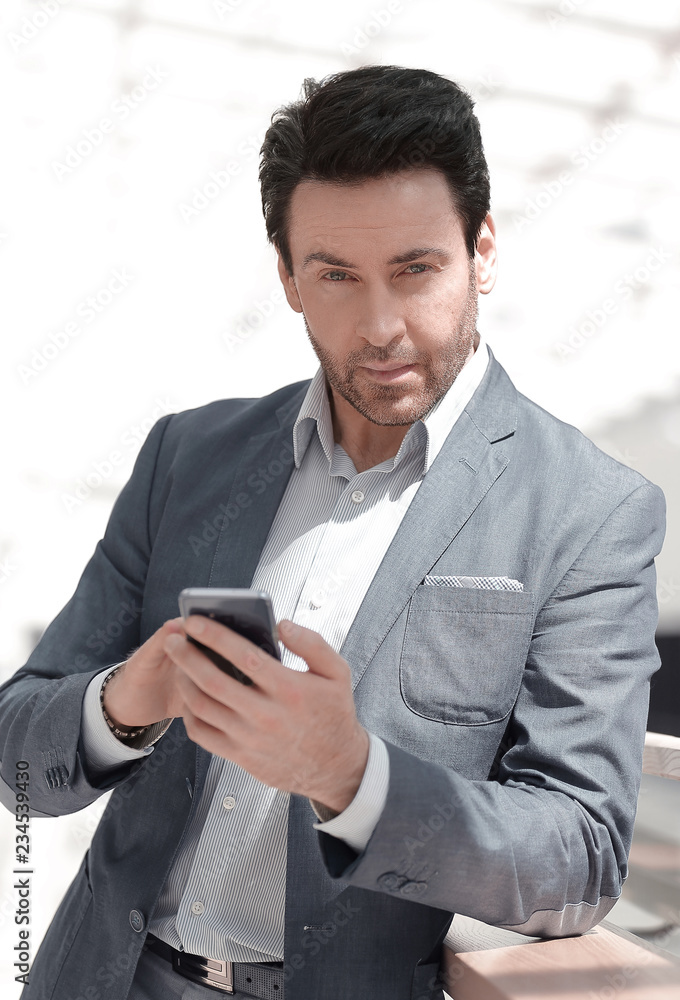 close up.businessman looking at the smartphone screen close up.businessman looking at the smartphone screen