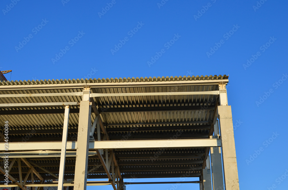 Fototapeta premium Building construction. Concrete structure beam column slab with cement material structure. Industrial warehouse hangar interior